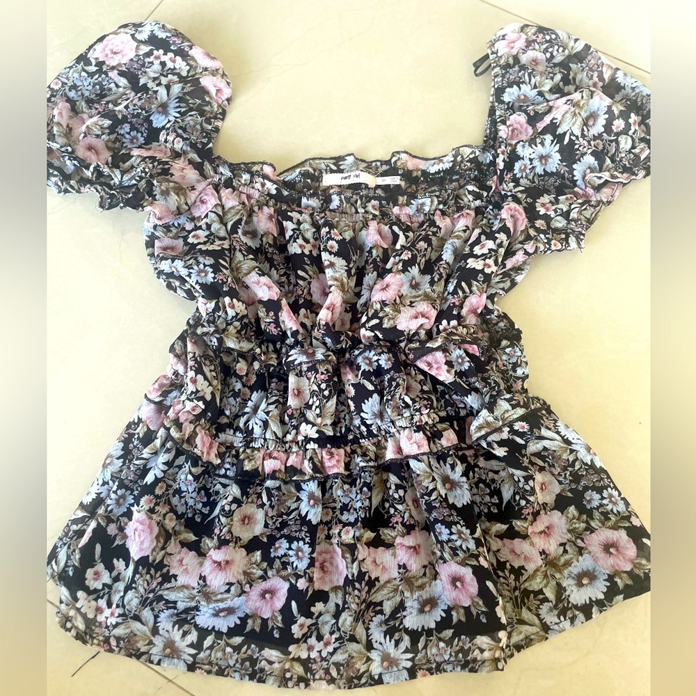 Black flowy blouse with light pink & light blue floral pattern!
